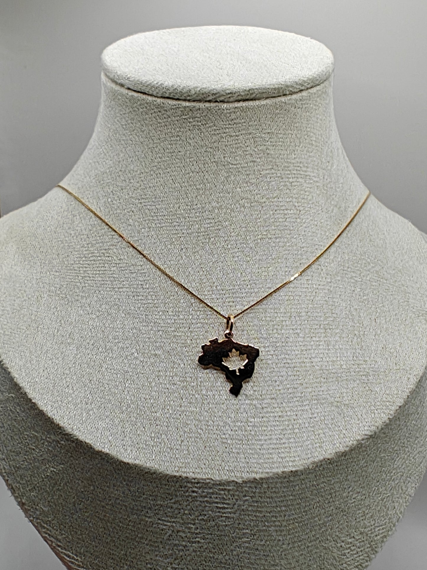 10K Gold Brazil & Maple Leaf Pendant