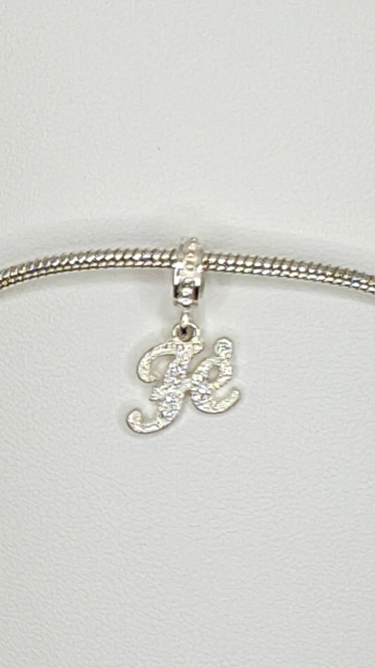 Silver “Fé” Charm